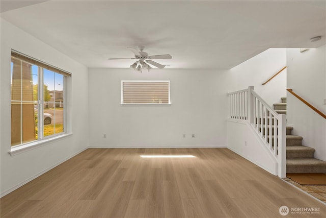 331 Index Ave SE, Renton, WA 98056 - spare room featuring light wood-style flooring, ceiling fan, stairs, and a smoke detector