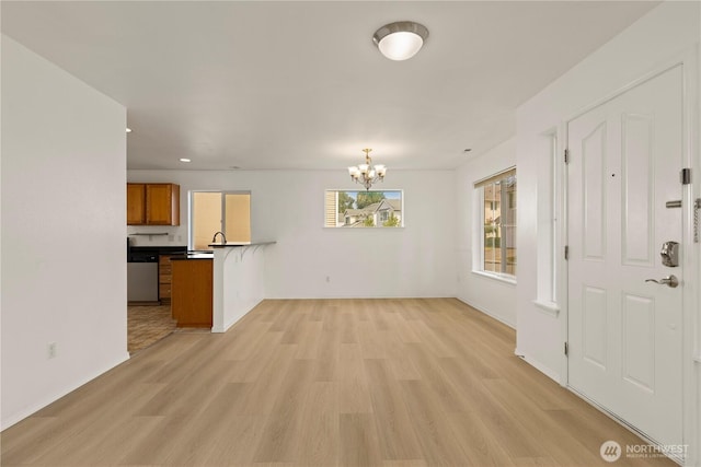 331 Index Ave SE, Renton, WA 98056 - entryway with light wood-style floors, a chandelier, and recessed lighting