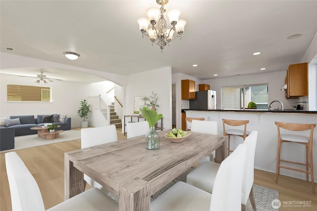 331 Index Ave SE, Renton, WA 98056 - dining area featuring stairs, arched walkways, light wood-style floors, recessed lighting, and ceiling fan