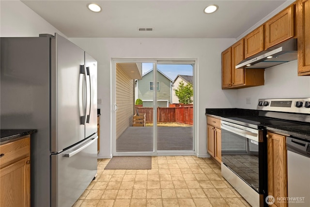 331 Index Ave SE, Renton, WA 98056 - kitchen featuring appliances with stainless steel finishes, under cabinet range hood, recessed lighting, brown cabinetry, and stone finish floors