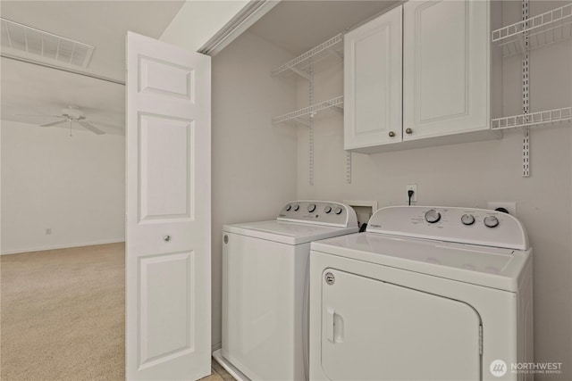 331 Index Ave SE, Renton, WA 98056 - laundry room with separate washer and dryer, cabinet space, ceiling fan, and light colored carpet