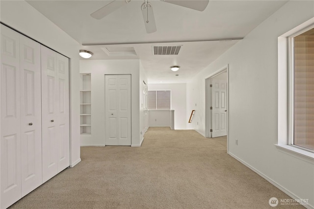 331 Index Ave SE, Renton, WA 98056 - unfurnished bedroom featuring carpet, two closets, and ceiling fan