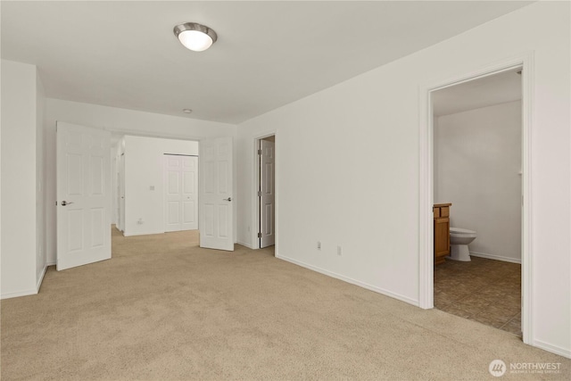 331 Index Ave SE, Renton, WA 98056 - unfurnished bedroom featuring light colored carpet, connected bathroom, and a closet