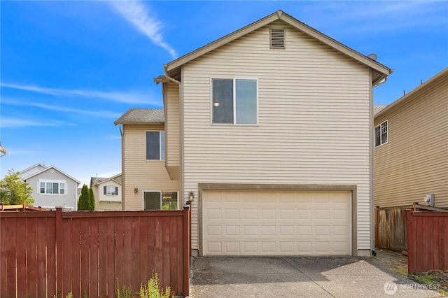 331 Index Ave SE, Renton, WA 98056 - rear view of house featuring asphalt driveway and a garage
