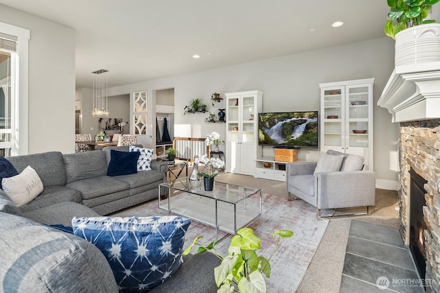 2283 244th Ave SE, Sammamish, WA 98075 - living area with a fireplace, a chandelier, and recessed lighting