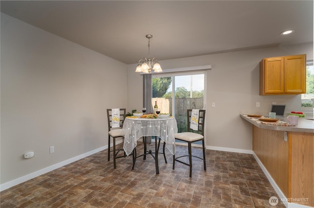 9960 Locust Ct SE, Yelm, WA 98597 - dining area with a chandelier, dark stone finish floors, and recessed lighting
