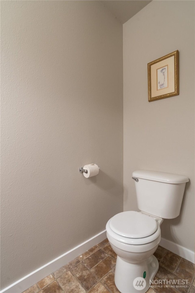 9960 Locust Ct SE, Yelm, WA 98597 - bathroom with toilet and baseboards