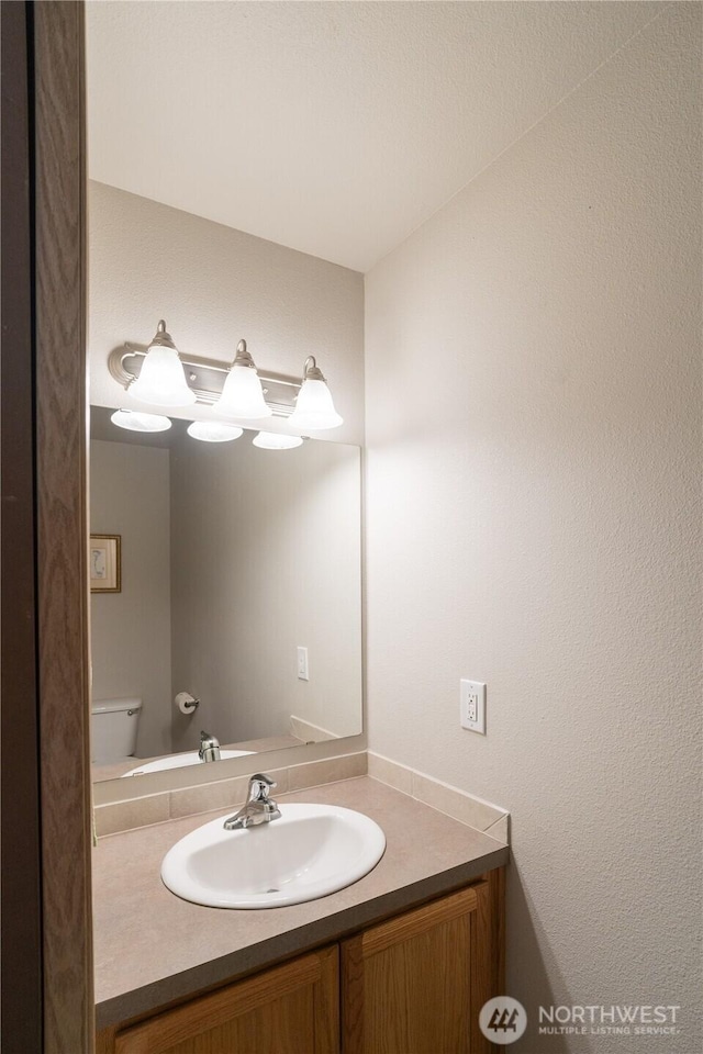 9960 Locust Ct SE, Yelm, WA 98597 - half bathroom featuring vanity and toilet