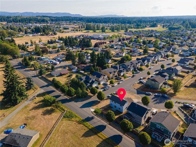 9960 Locust Ct SE, Yelm, WA 98597 - aerial view of property and surrounding area with a mountainous background and nearby suburban area