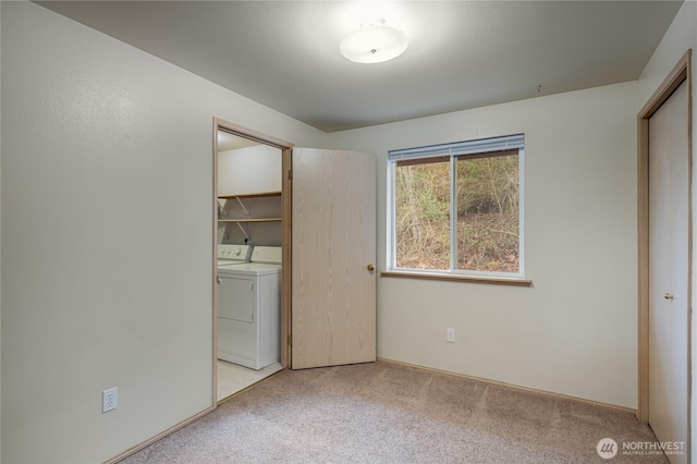 21312 87th Ave NE Unit 1 & 2, Arlington, WA 98223 - unfurnished bedroom featuring washer and dryer, carpet floors, and a closet