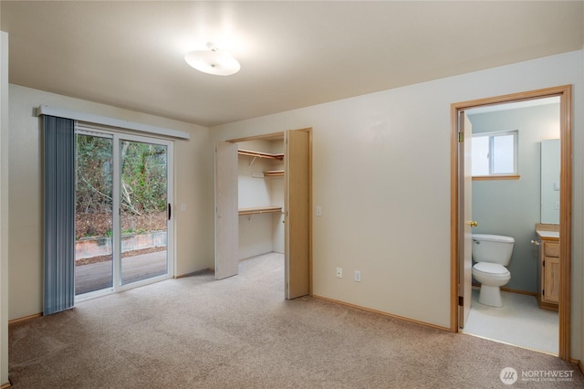 21312 87th Ave NE Unit 1 & 2, Arlington, WA 98223 - unfurnished bedroom with access to outside, connected bathroom, light colored carpet, and a closet