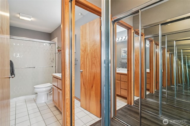 1707 NW 59th St Unit 302, Seattle, WA 98107 - full bathroom with vanity, tile patterned flooring, and a stall shower