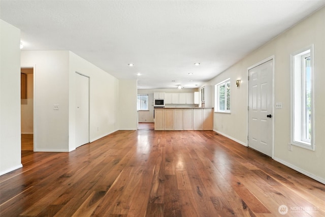 116 Noble Rd, Winlock, WA 98596 - unfurnished living room with dark wood-type flooring and recessed lighting