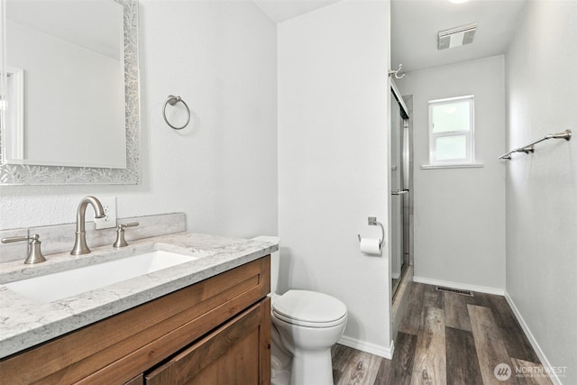 116 Noble Rd, Winlock, WA 98596 - bathroom featuring a shower stall, wood finished floors, and vanity