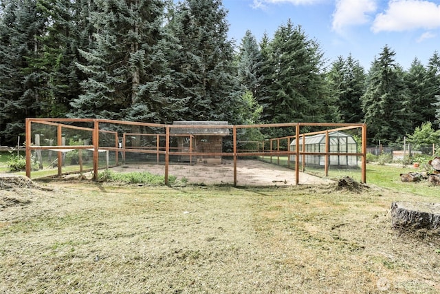 116 Noble Rd, Winlock, WA 98596 - view of home's community featuring a greenhouse, an outbuilding, and a wooded view