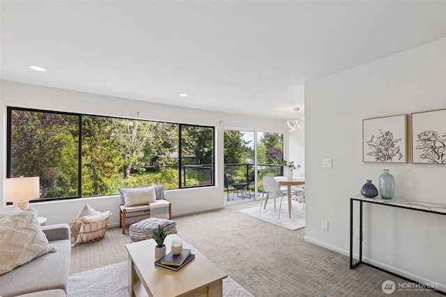 19414 Aurora Ave N Unit 203, Shoreline, WA 98133 - carpeted living area with recessed lighting and a chandelier