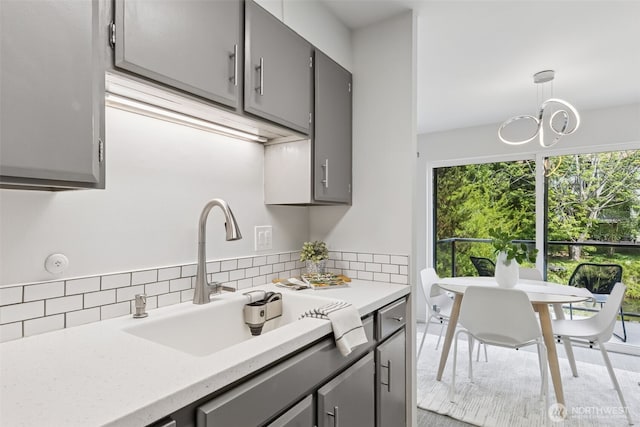 19414 Aurora Ave N Unit 203, Shoreline, WA 98133 - kitchen with gray cabinetry and backsplash