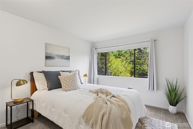 19414 Aurora Ave N Unit 203, Shoreline, WA 98133 - bedroom featuring baseboards and carpet flooring