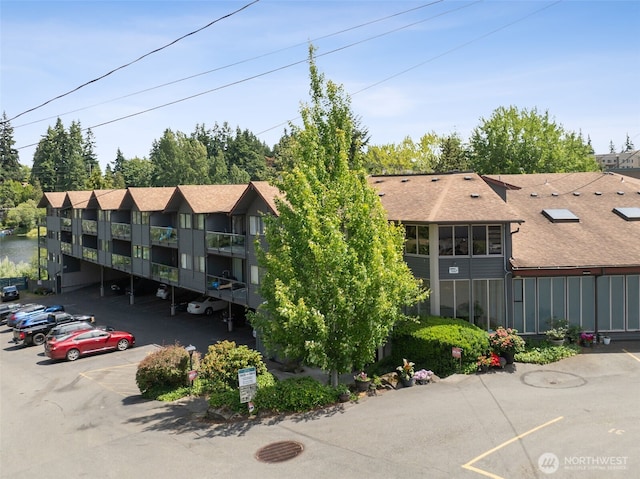 19414 Aurora Ave N Unit 203, Shoreline, WA 98133 - view of building exterior with uncovered parking