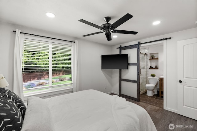 4011 65th Ave NW, Gig Harbor, WA 98335 - bedroom with a barn door, wood finished floors, recessed lighting, connected bathroom, and a ceiling fan