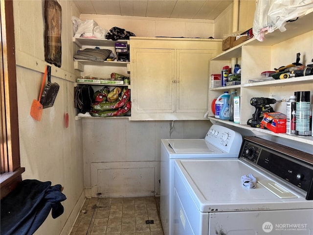 1105 Central Ave, Oroville, WA 98844 - washroom with cabinet space and washing machine and clothes dryer