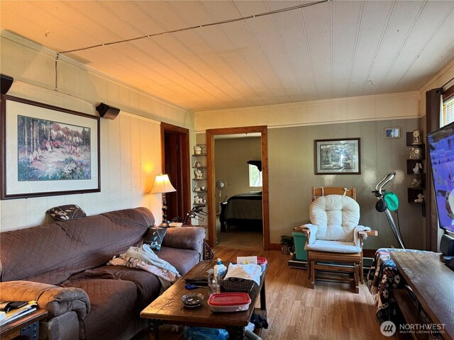 1105 Central Ave, Oroville, WA 98844 - living area featuring wood finished floors, ornamental molding, and wooden ceiling