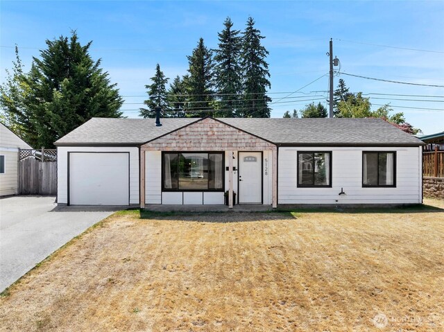 5128 N 48th St, Tacoma, WA 98407 - view of front facade featuring roof with shingles, driveway, and a garage