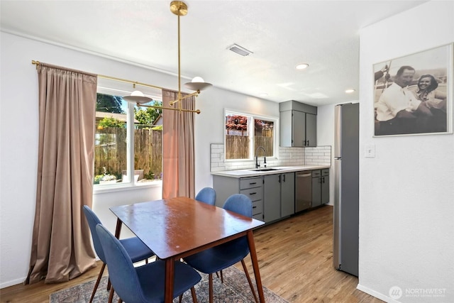 5128 N 48th St, Tacoma, WA 98407 - dining space featuring light wood-style flooring and recessed lighting