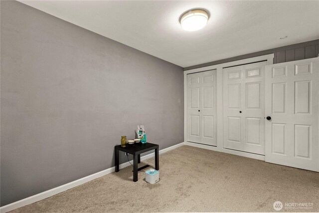 12027 78th Ave S, Seattle, WA 98178 - unfurnished bedroom featuring carpet and two closets
