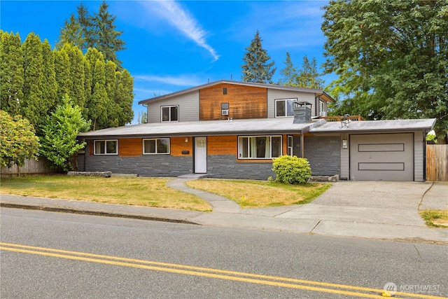 12027 78th Ave S, Seattle, WA 98178 - view of front of property with a garage, stone siding, and asphalt driveway