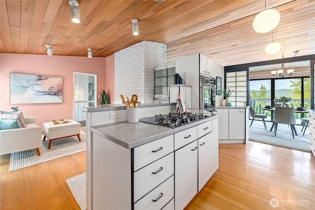 818 179th Pl NE, Bellevue, WA 98008 - kitchen featuring black gas stovetop, wooden ceiling, stainless steel oven, light wood-style floors, and white cabinets