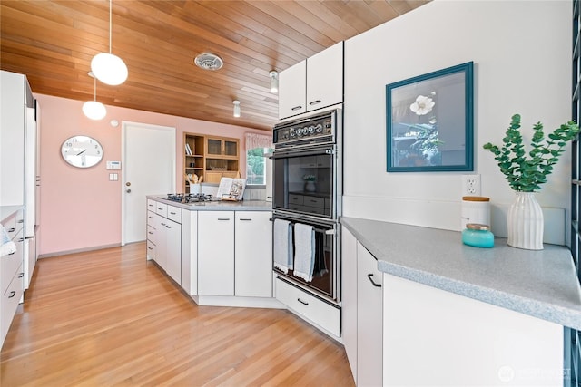 818 179th Pl NE, Bellevue, WA 98008 - kitchen featuring white cabinetry, hanging light fixtures, light wood-style flooring, stainless steel gas cooktop, and wooden ceiling