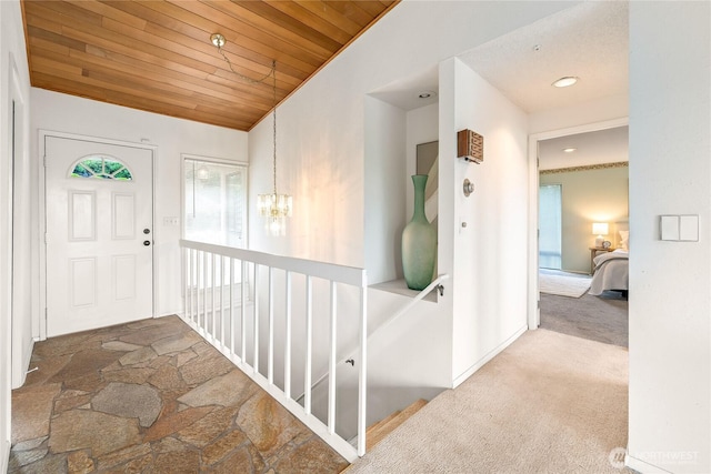 818 179th Pl NE, Bellevue, WA 98008 - foyer entrance with wood ceiling, carpet, a chandelier, and recessed lighting