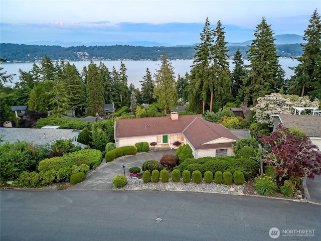 818 179th Pl NE, Bellevue, WA 98008 - view of subject property featuring a nearby body of water and a forest