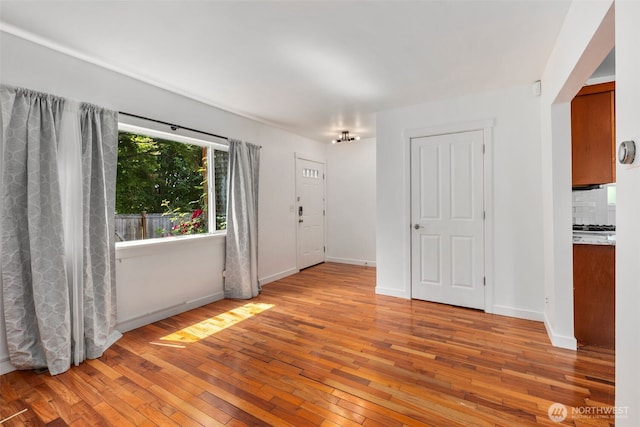 2033 E Wright Ave, Tacoma, WA 98404 - empty room with light wood-type flooring and baseboards