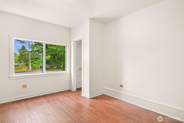 1609 F St, Bellingham, WA 98225 - unfurnished bedroom with wood-type flooring and baseboards