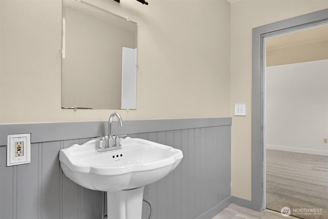 1609 F St, Bellingham, WA 98225 - bathroom featuring a wainscoted wall and a sink