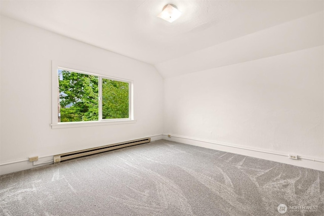 1609 F St, Bellingham, WA 98225 - carpeted spare room featuring a baseboard radiator and lofted ceiling