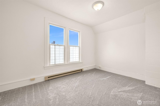 1609 F St, Bellingham, WA 98225 - unfurnished room featuring a baseboard radiator, carpet, plenty of natural light, and vaulted ceiling