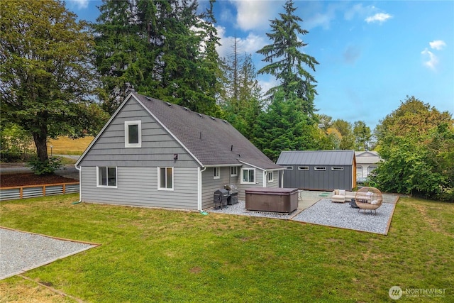 4415 Waller Rd E, Tacoma, WA 98443 - rear view of property featuring a hot tub, a patio area, and an outdoor structure