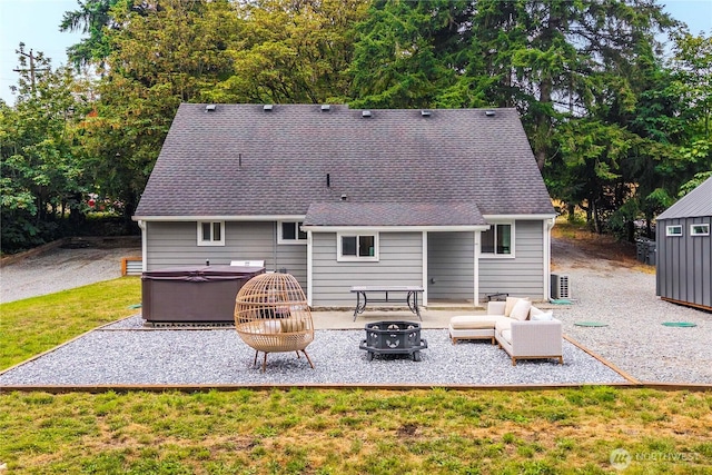 4415 Waller Rd E, Tacoma, WA 98443 - back of house with a patio area, a hot tub, an outdoor living space with a fire pit, a lawn, and a shingled roof