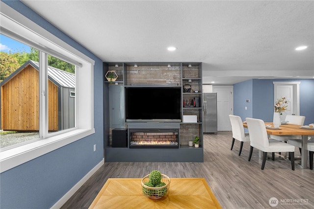 4415 Waller Rd E, Tacoma, WA 98443 - living room with a fireplace, wood finished floors, and recessed lighting