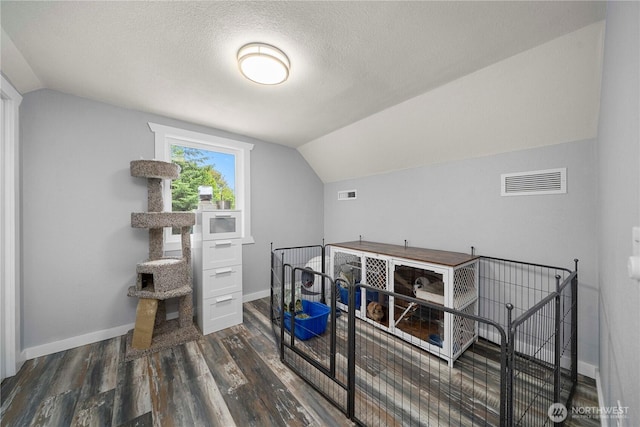 4415 Waller Rd E, Tacoma, WA 98443 - bonus room featuring lofted ceiling, wood finished floors, and a textured ceiling