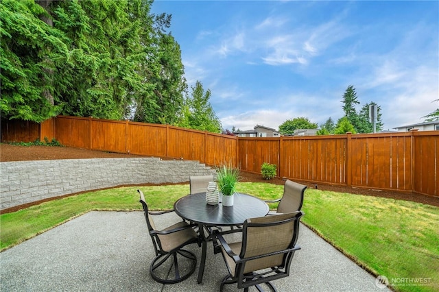10259 133rd Ct NE, Redmond, WA 98033 - fenced backyard featuring a patio and outdoor dining space