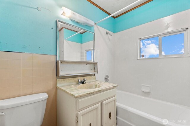 18056 25th Ave NE, Lake Forest Park, WA 98155 - bathroom with vanity,  shower combination, and tile walls
