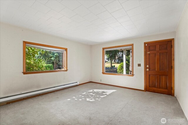 18056 25th Ave NE, Lake Forest Park, WA 98155 - carpeted spare room featuring a baseboard heating unit