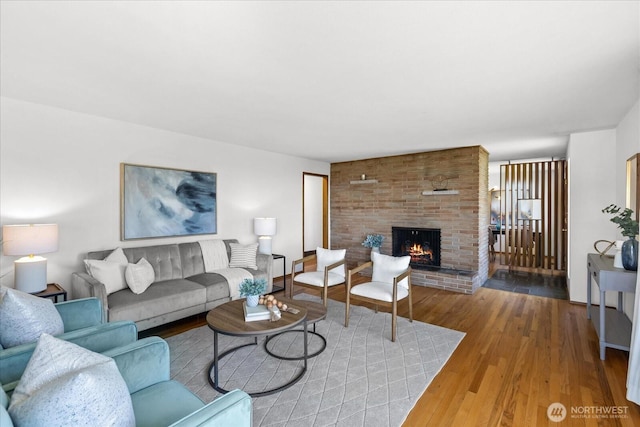 731 Melody Ln, Edmonds, WA 98020 - living room featuring a brick fireplace and wood finished floors