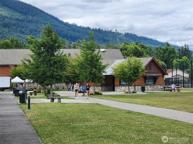 133 W 4th St, North Bend, WA 98045 - view of community featuring a mountain view, a lawn, and a wooded view