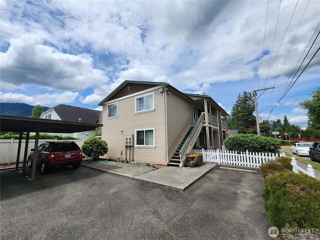 133 W 4th St, North Bend, WA 98045 - view of home's exterior featuring stairway and covered parking