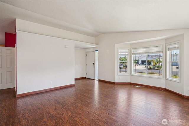 87 Chickadee Dr, Kelso, WA 98626 - empty room with wood finished floors and lofted ceiling